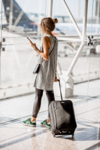 Best travel apps for 2026 shown with phone, passport, and coffee for international trip planning
